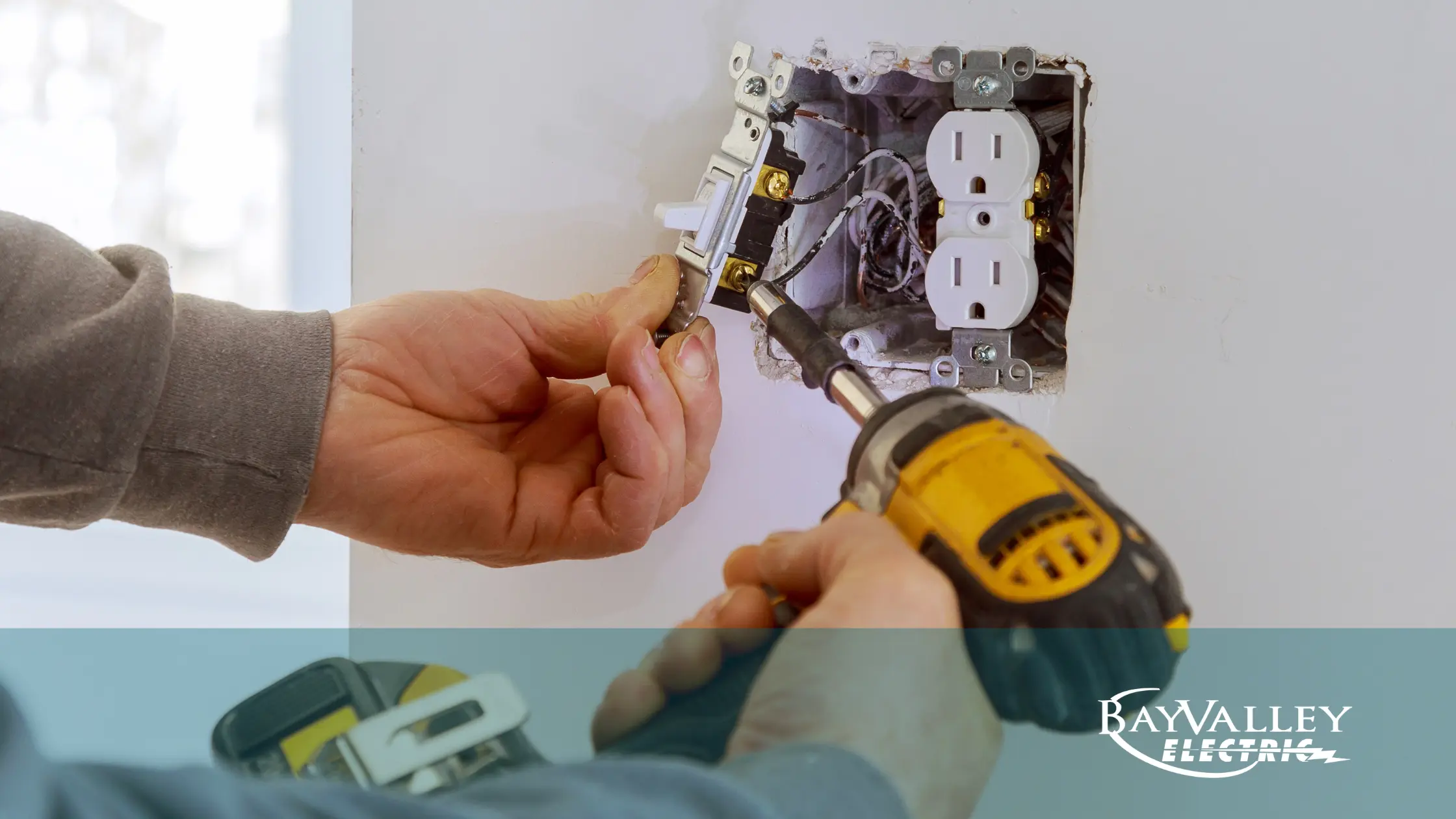 Electrician inspecting home wiring for common electrical problems.